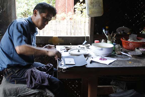 The gemstone is polished by hand