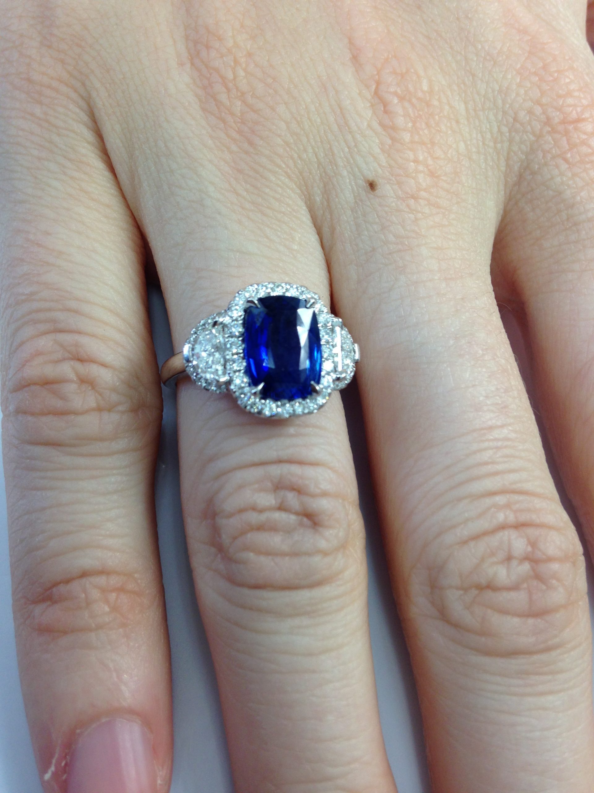 blue sapphire ring on hand