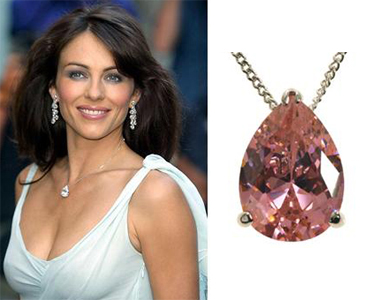 Elizabeth Hurley wearing a pear shaped pink sapphire solitaire pendant