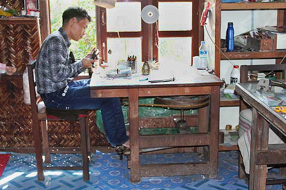 gem cutter working on the cabochon