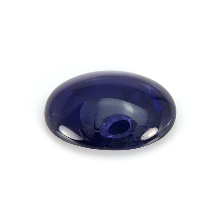 Natural 7.64 carat Burma blue oval cabochon sapphire on a white background