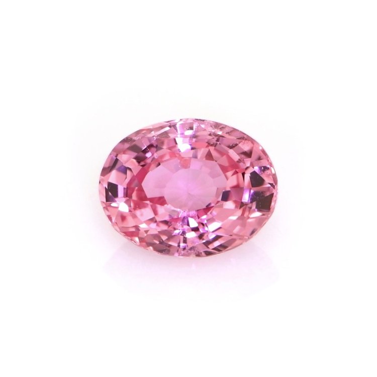 Natural 1.74 carat Ceylon padparadscha oval sapphire on a white background