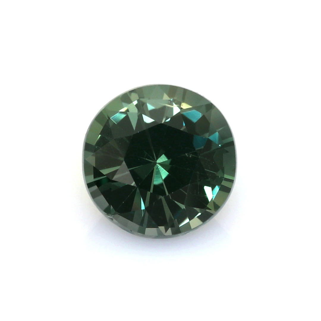 Natural 2.14 carat Madagascar bluish green round sapphire on a white background