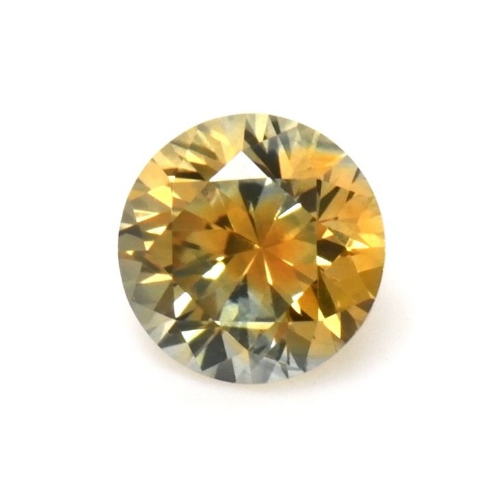 Natural 0.54 carat Montana parti-color round sapphire in yellow and grey-green on a white background